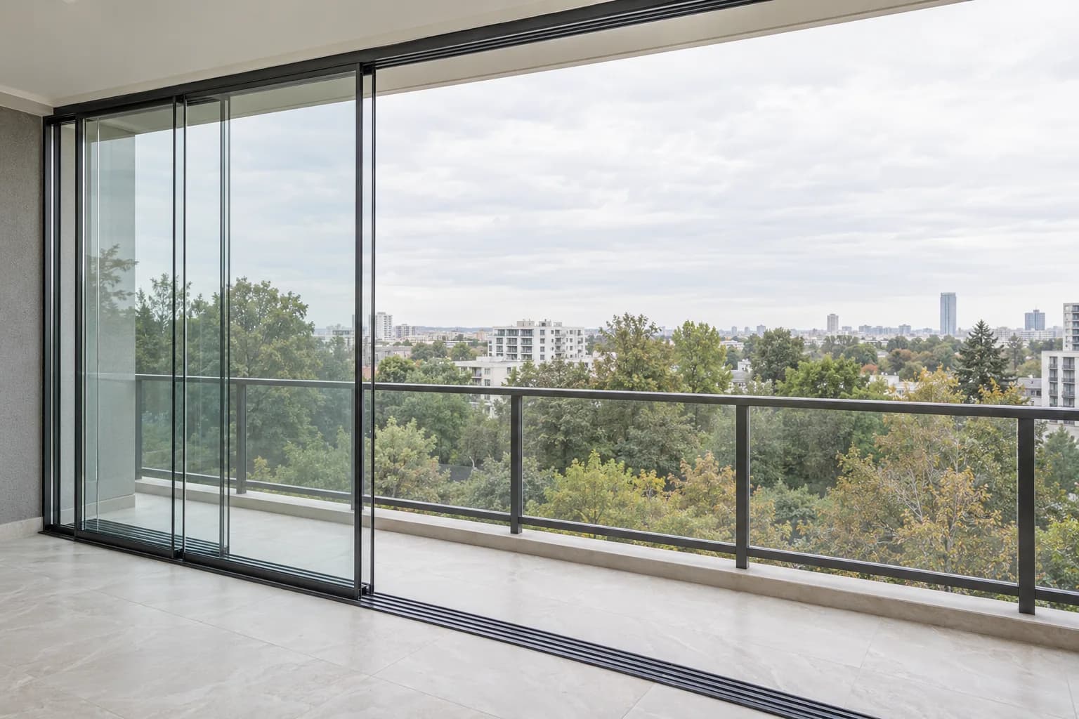 Balcony enclosure with sliding glass panels